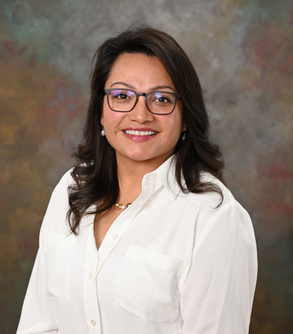 Council Member Christine Townes is wearing a white blouse and glasses.